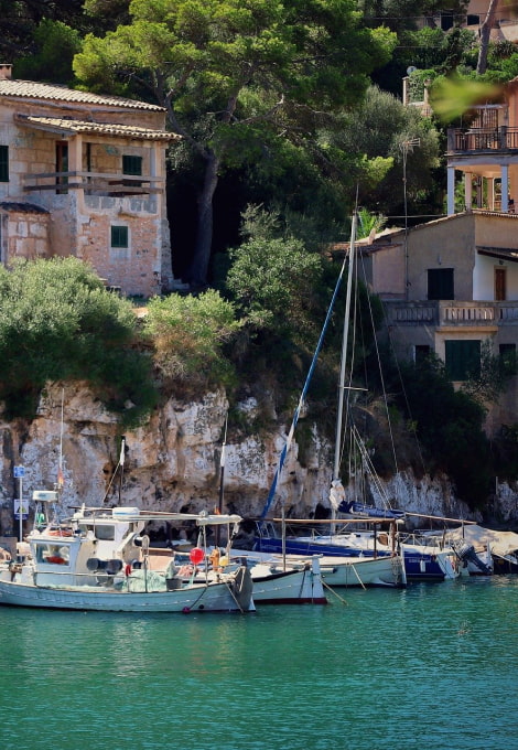 Traditional Mallorcan boats beached in the harbour