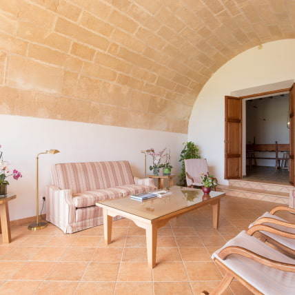 Detail of the reception area, with sofa and armchairs